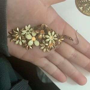 Dangling cream and brass flower earrings